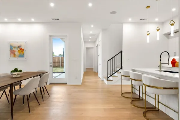 a view of kitchen with furniture and wooden floor