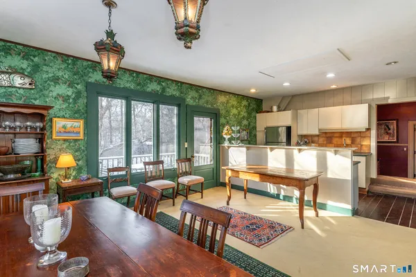 a kitchen with stainless steel appliances granite countertop a stove and a refrigerator