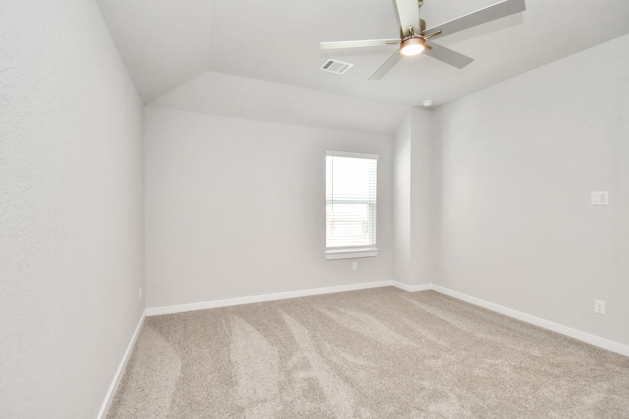 3106 Native Spg Drive Spring, TX 77373 - Photo 33 of 38 Secondary bedroom features plush carpeting, large windows that let in plenty of natural light, bright paint, and spacious closets. Sample photo of completed home with similar floor plan. Actual colors and selections may vary.