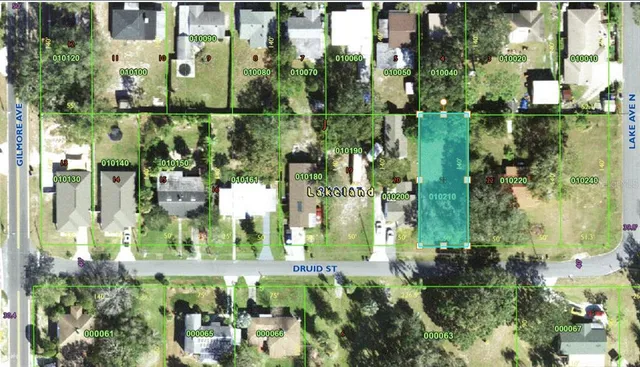 an aerial view of residential houses with outdoor space and street view