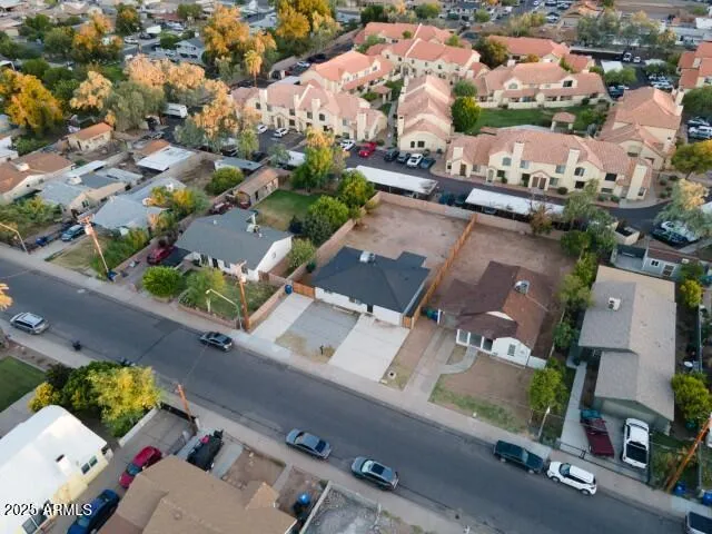 an aerial view of residential houses with outdoor space
