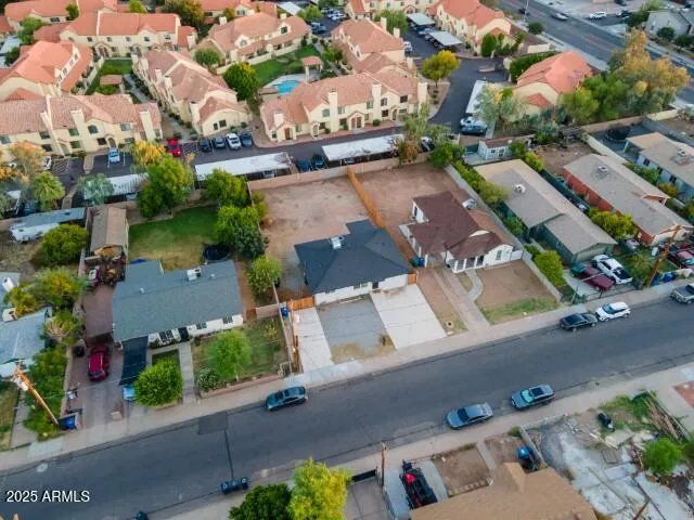 an aerial view of residential houses with outdoor space