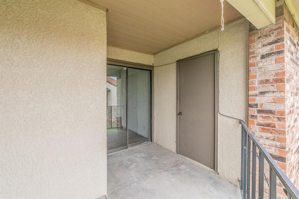 920 Turtle Cove, Unit 252 Irving, TX 75060 - Photo 27 of 34 Entrance to property with stucco siding and brick siding