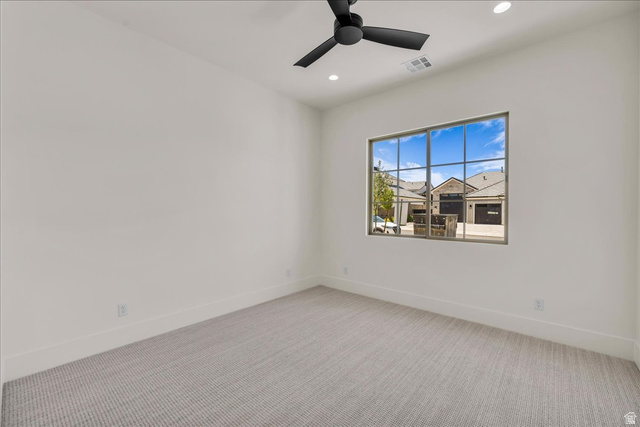 1620 Belayer Drive St. George, UT 84770 - Photo 15 of 51 Spacious interior room featuring a large multi-pane window, recessed lighting, and a contemporary ceiling fan