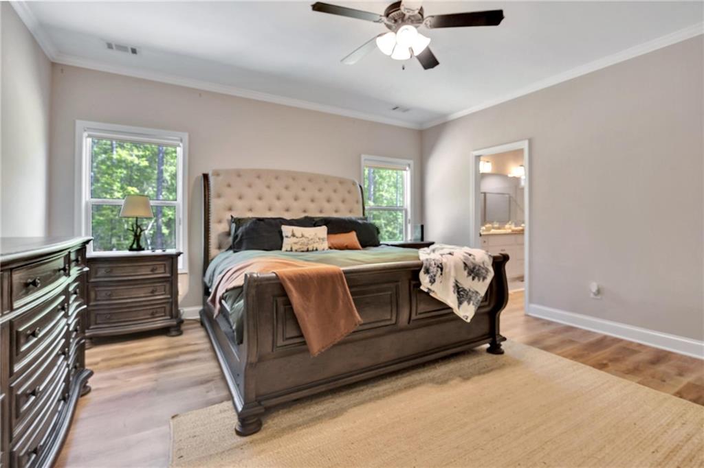 90 Scouts Ridge Drive Covington, GA 30016 - Photo 11 of 21 a bed sitting in a bedroom next to a window