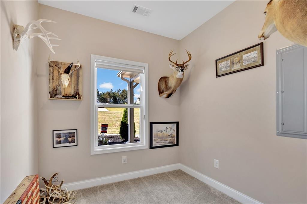 90 Scouts Ridge Drive Covington, GA 30016 - Photo 15 of 21 a view of a hallway with paintings on the wall