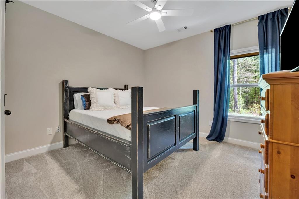 90 Scouts Ridge Drive Covington, GA 30016 - Photo 16 of 21 a bed room with a bed and a window