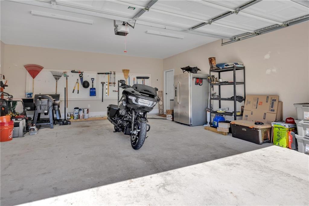 90 Scouts Ridge Drive Covington, GA 30016 - Photo 19 of 21 a view of a garage with a bike