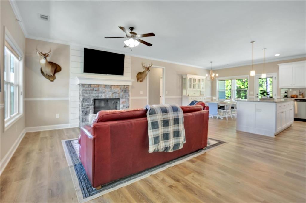 90 Scouts Ridge Drive Covington, GA 30016 - Photo 5 of 21 a living room with furniture a fireplace and a flat screen tv