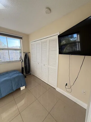 a room with a bed and a window