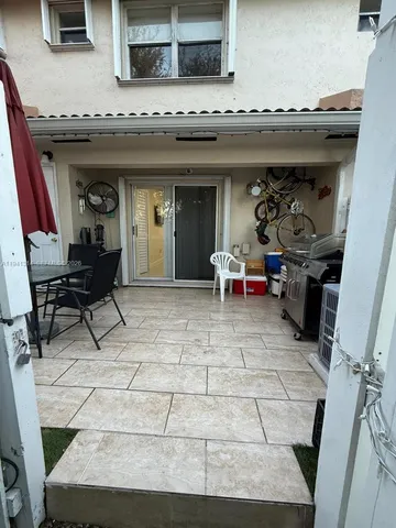 a view of a lounge chairs in the patio