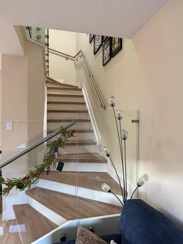 a living room with furniture and a christmas tree