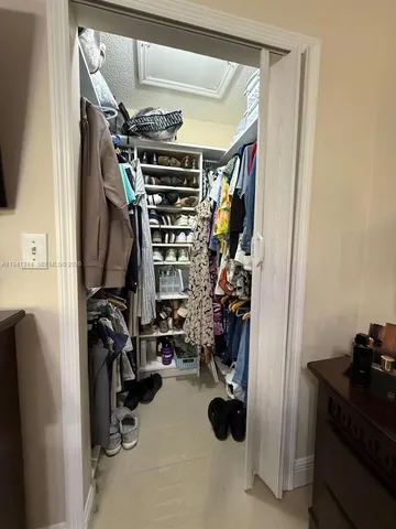 a spacious bathroom with a toilet a sink and shower