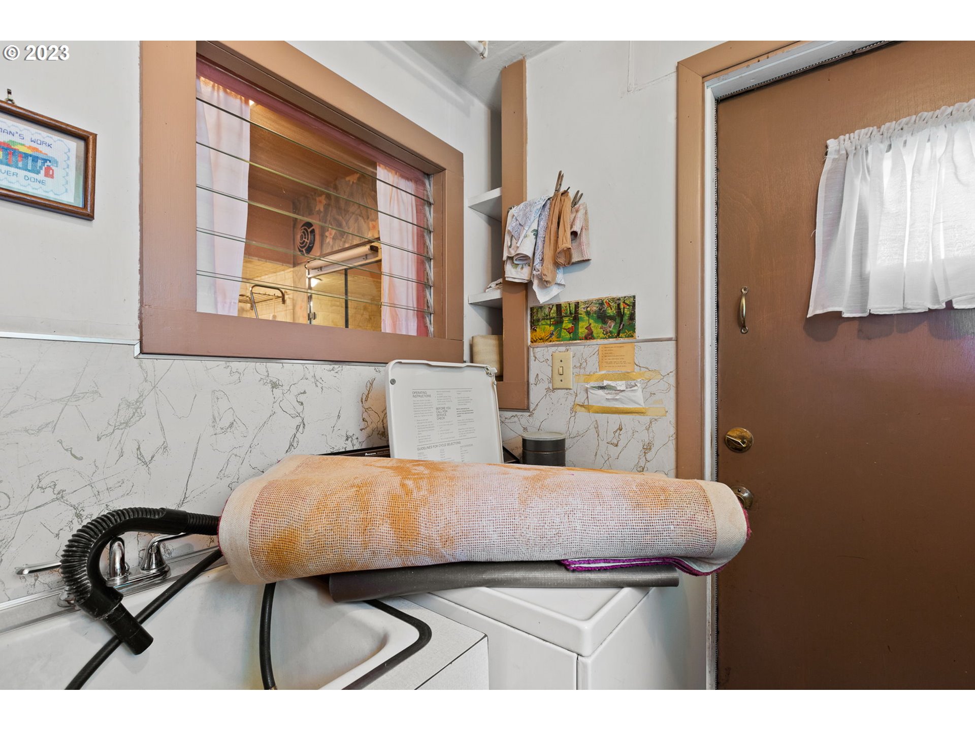3554 Southwest Falcon Street Portland, OR 97219 - Photo 13 of 23 a bedroom with a bed and a dresser