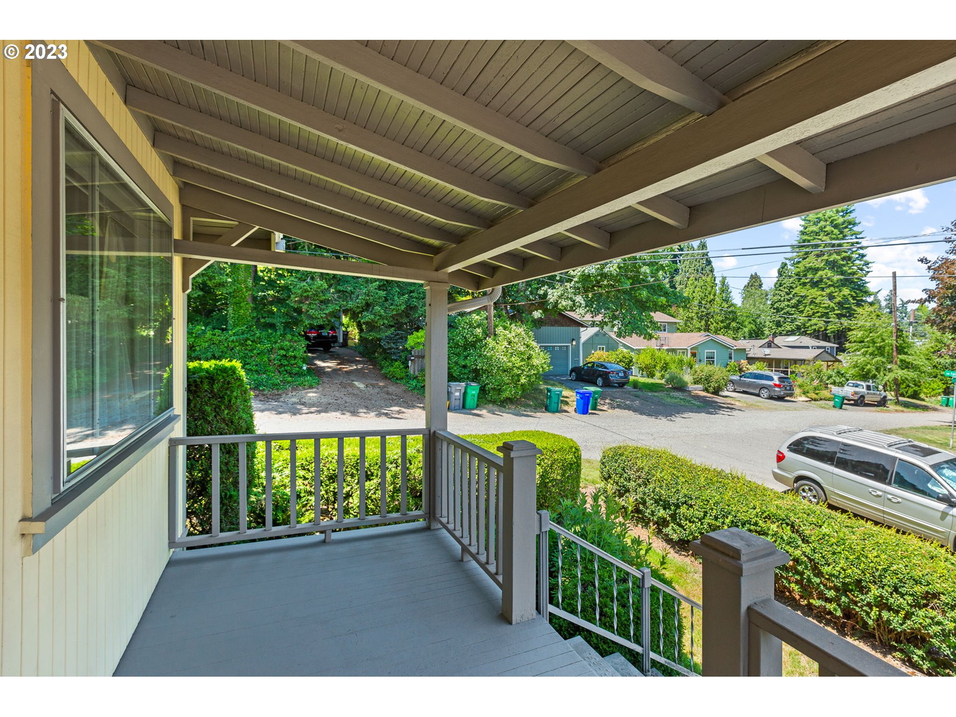 3554 Southwest Falcon Street Portland, OR 97219 - Photo 22 of 23 a view of a porch with furniture and garden