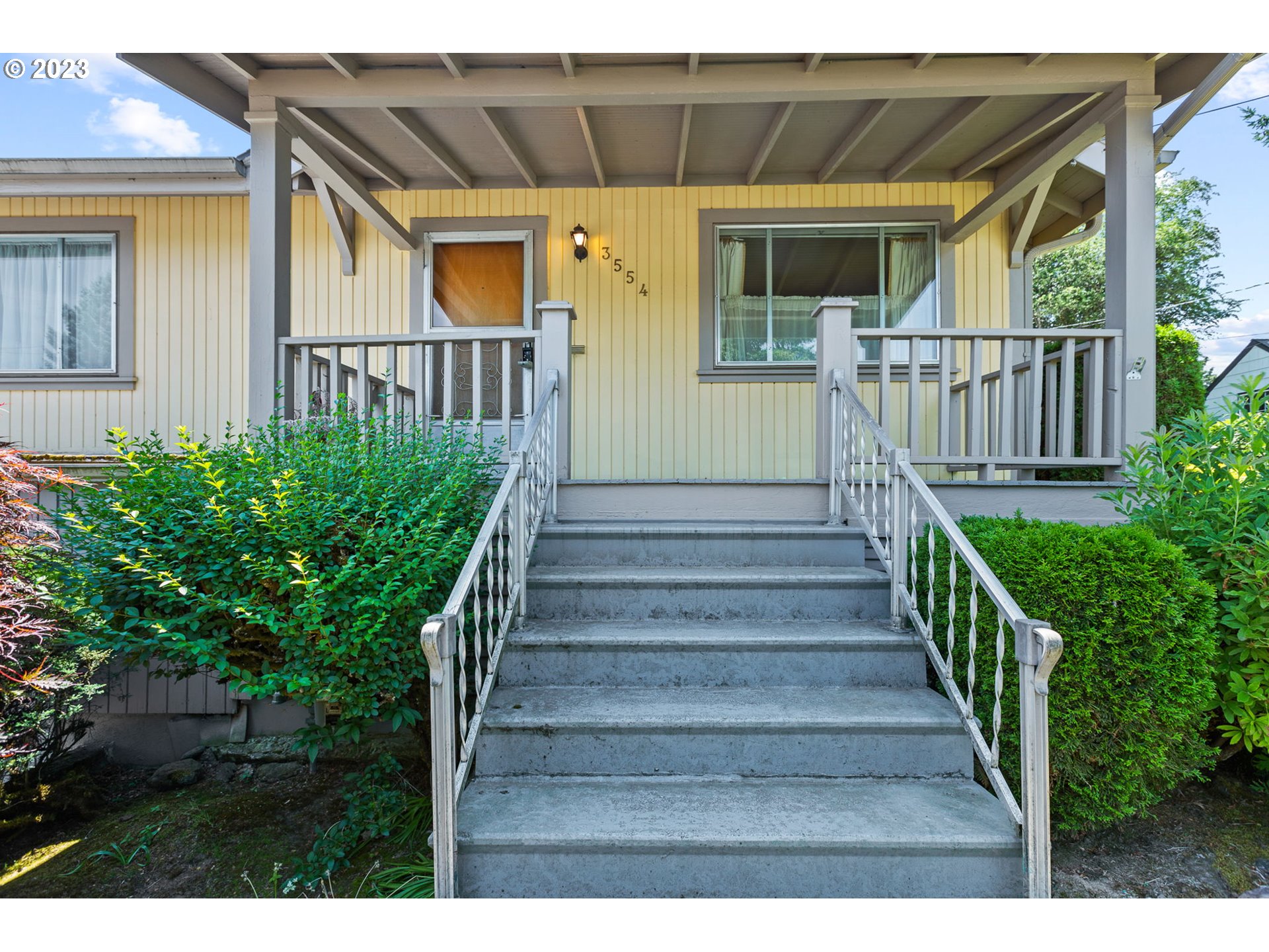 3554 Southwest Falcon Street Portland, OR 97219 - Photo 3 of 23 a view of a house with wooden stairs