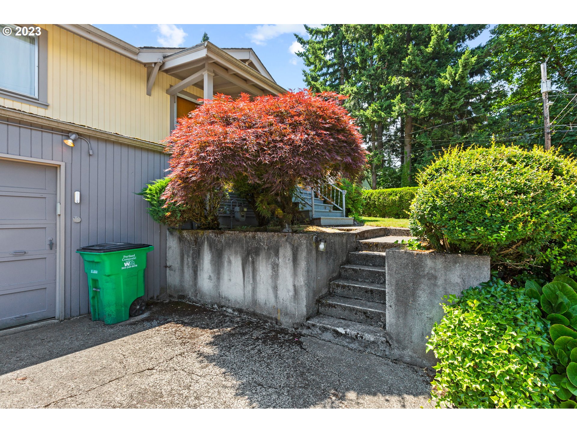 3554 Southwest Falcon Street Portland, OR 97219 - Photo 4 of 23 a backyard of a house with lots of green space