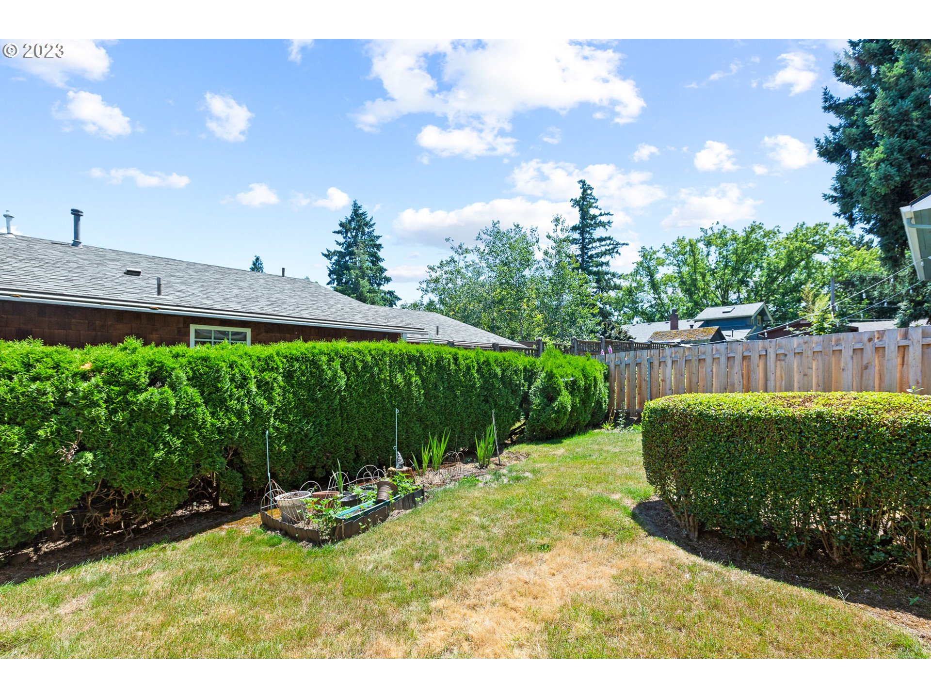 3554 Southwest Falcon Street Portland, OR 97219 - Photo 6 of 23 a view of a backyard