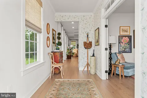 a view of a livingroom with furniture and a window