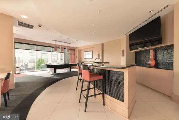 a room with furniture and a flat screen tv