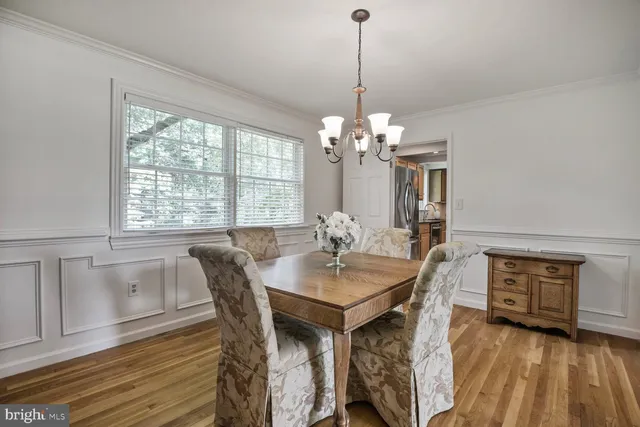 a living room with dining table