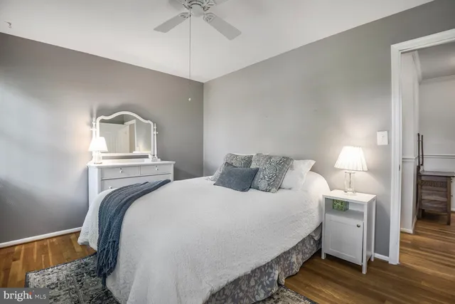 a spacious bedroom with a bed and a window