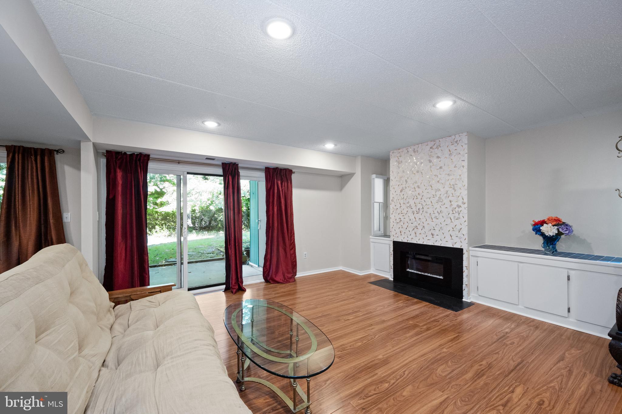 5653 Harpers Farm Road, Unit B Columbia, MD 21044 - Photo 6 of 29 Living room slider to patio