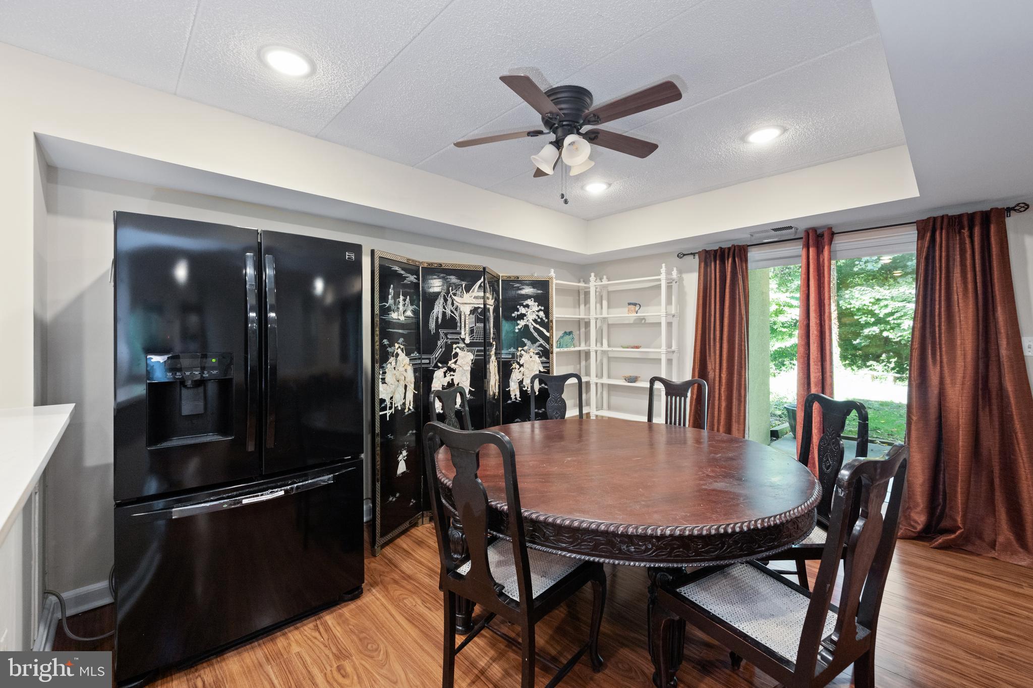 5653 Harpers Farm Road, Unit B Columbia, MD 21044 - Photo 10 of 29 Dining room with slider to patio