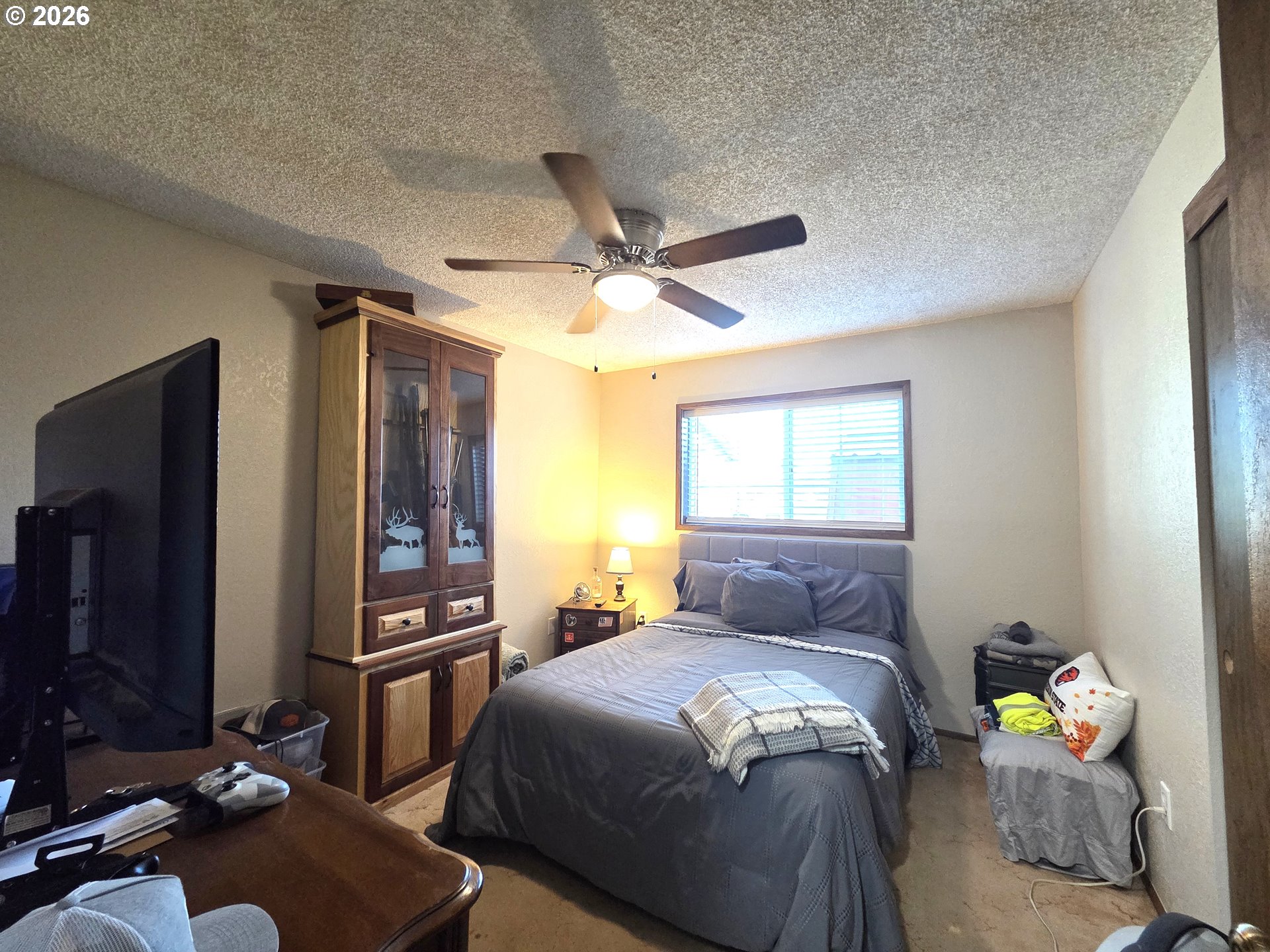 740 North 11th Street Elgin, OR 97827 - Photo 8 of 20 a bedroom with a bed dresser and a window