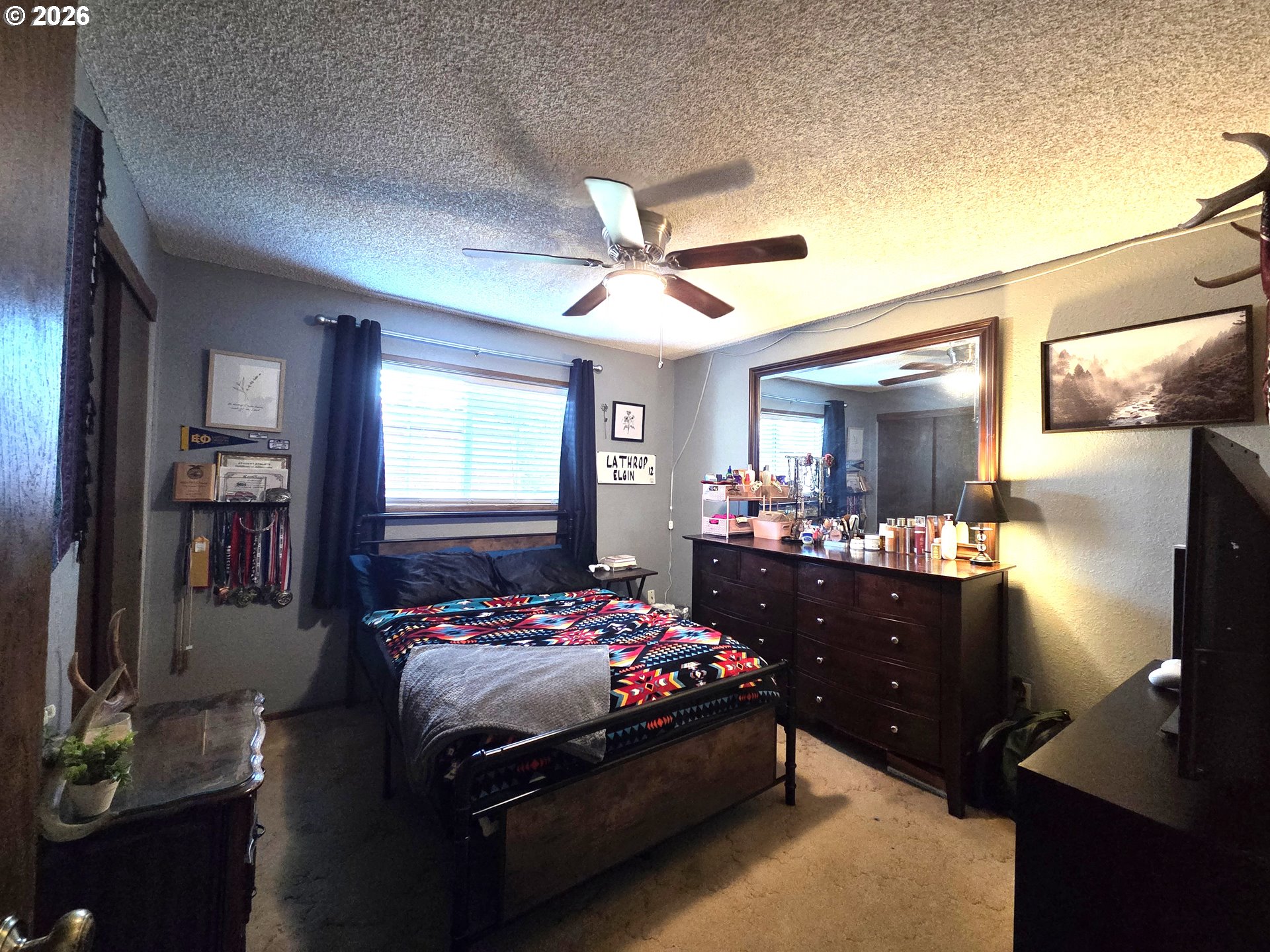 740 North 11th Street Elgin, OR 97827 - Photo 9 of 20 a bedroom with a bed and window
