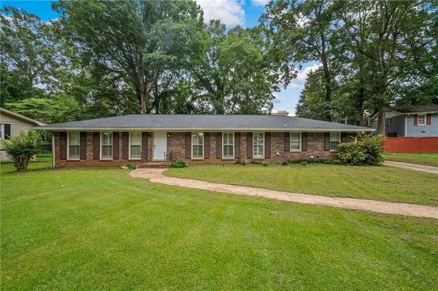 front view of a house with a yard