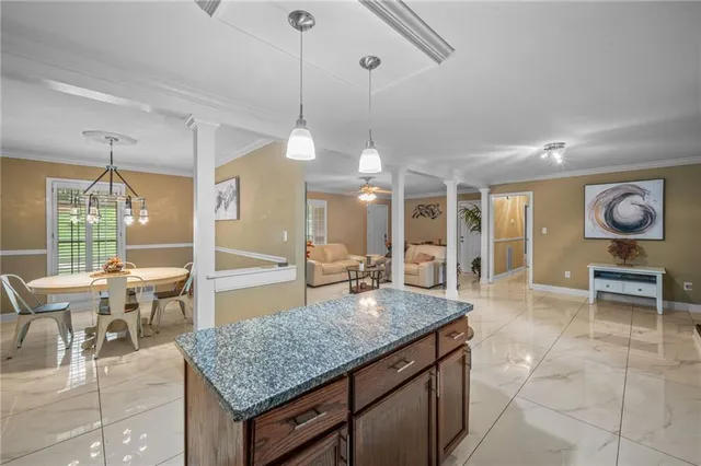 a kitchen with a table and chairs in it