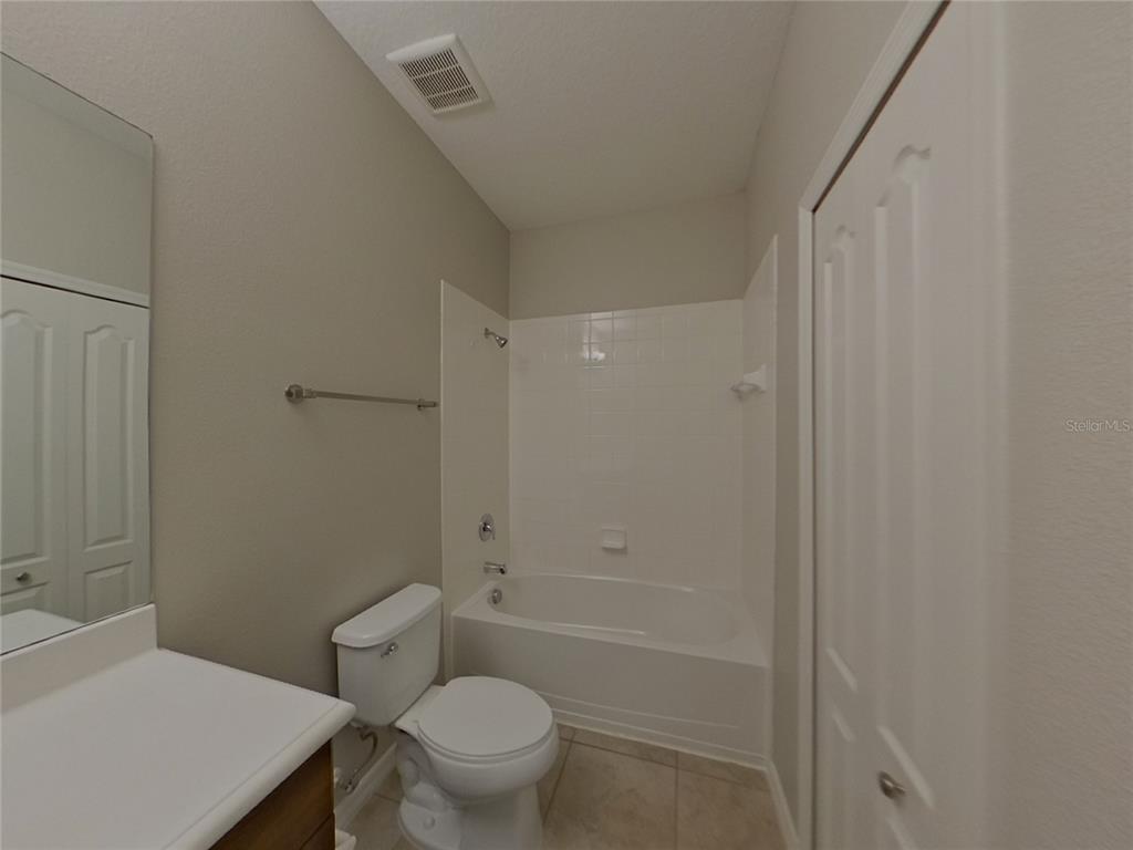 Undisclosed Address Parrish, FL 34219 - Photo 12 of 16 a bathroom with a sink a toilet and shower