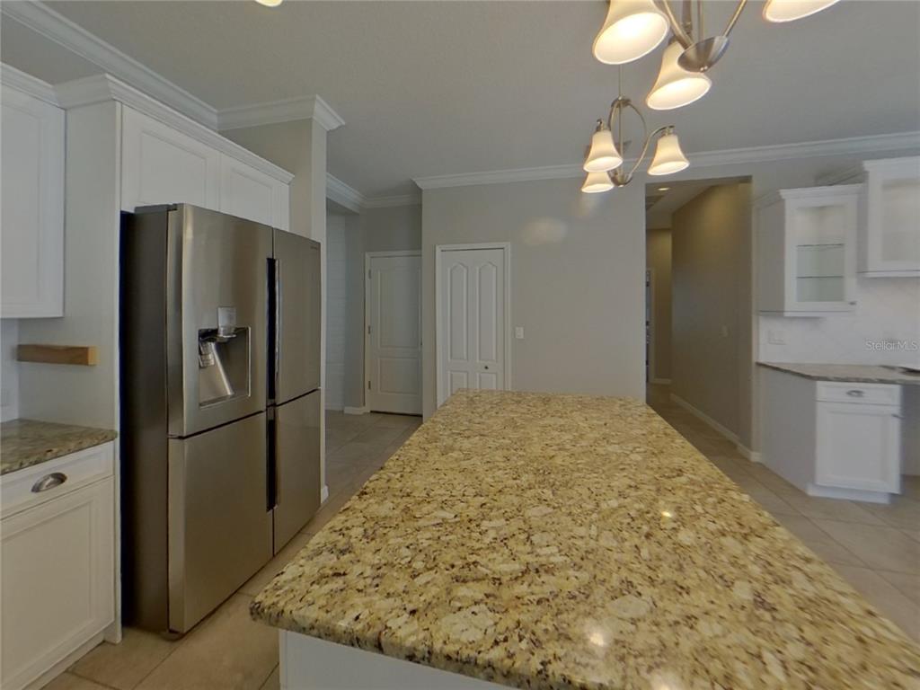 Undisclosed Address Parrish, FL 34219 - Photo 6 of 16 a kitchen with stainless steel appliances granite countertop a refrigerator and a sink