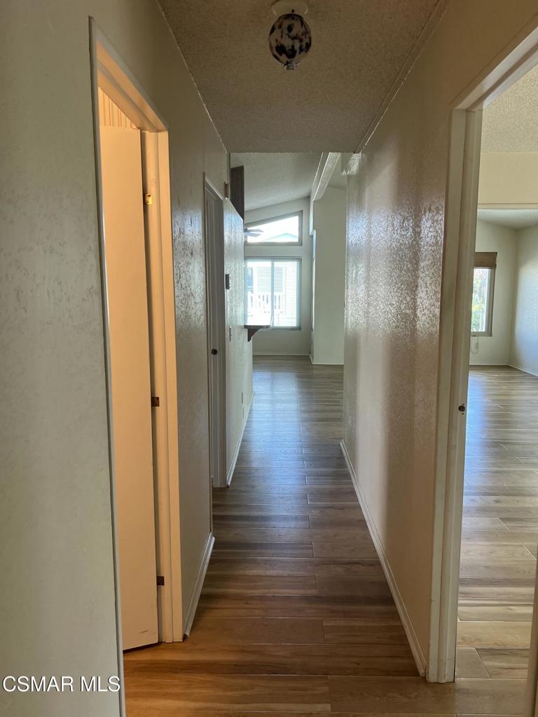 122 Don Felipe, Unit 122 Ojai, CA 93023 - Photo 18 of 50 a view of a hallway with wooden floor