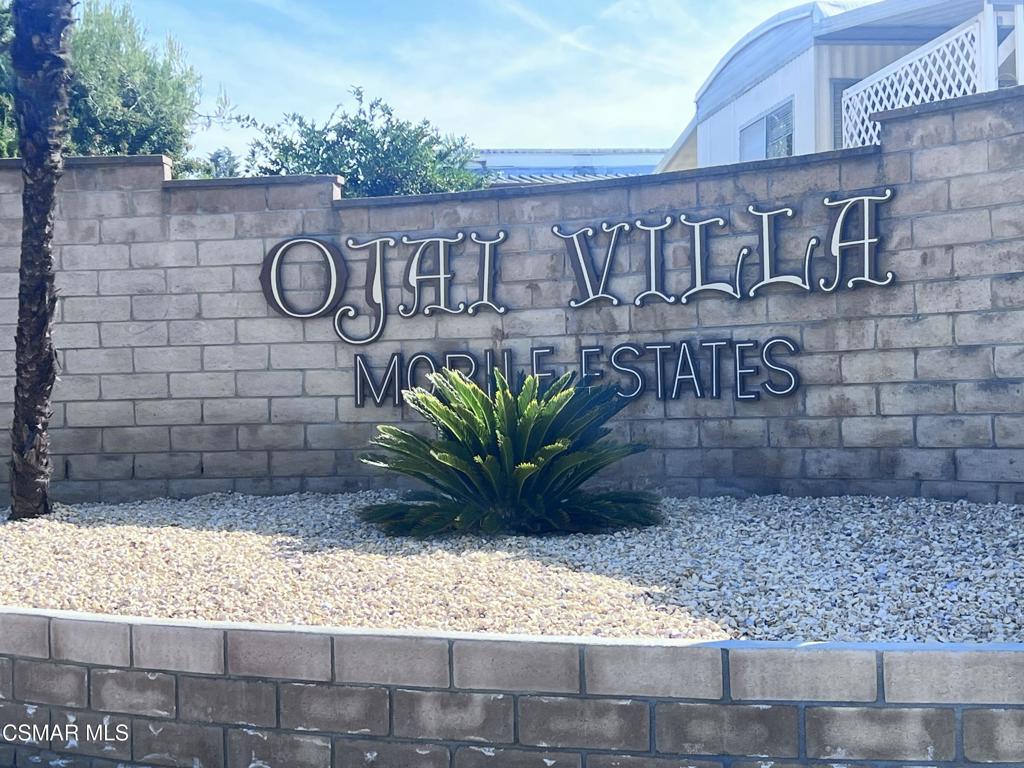122 Don Felipe, Unit 122 Ojai, CA 93023 - Photo 31 of 50 a view of a wooden door with a bench in front of it