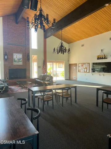 a kitchen with stainless steel appliances a sink a stove a refrigerator a sink and cabinets