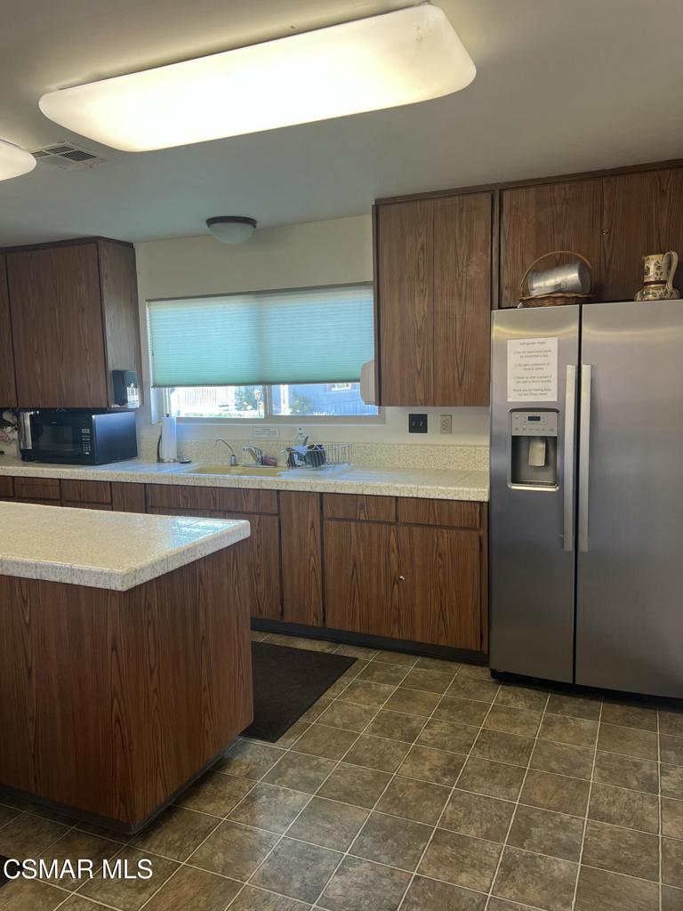 122 Don Felipe, Unit 122 Ojai, CA 93023 - Photo 43 of 50 a kitchen with stainless steel appliances a sink a stove a refrigerator a sink and cabinets