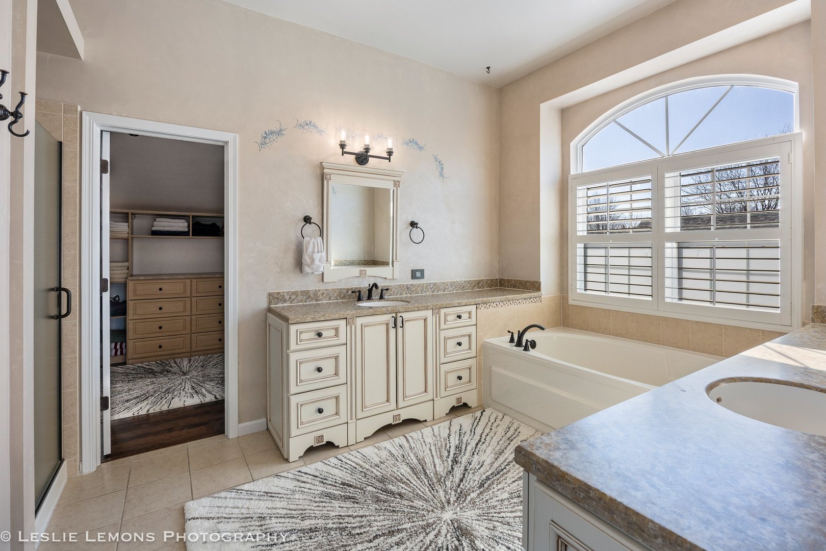 526 Windett Lane Geneva, IL 60134 - Photo 15 of 38 a spacious bathroom with a granite countertop tub and a sink