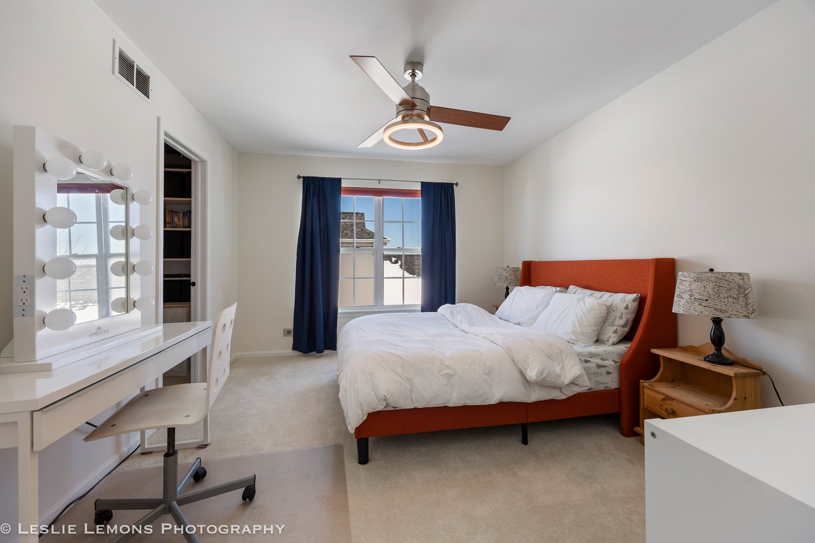 526 Windett Lane Geneva, IL 60134 - Photo 19 of 38 a bedroom with a bed and a chandelier