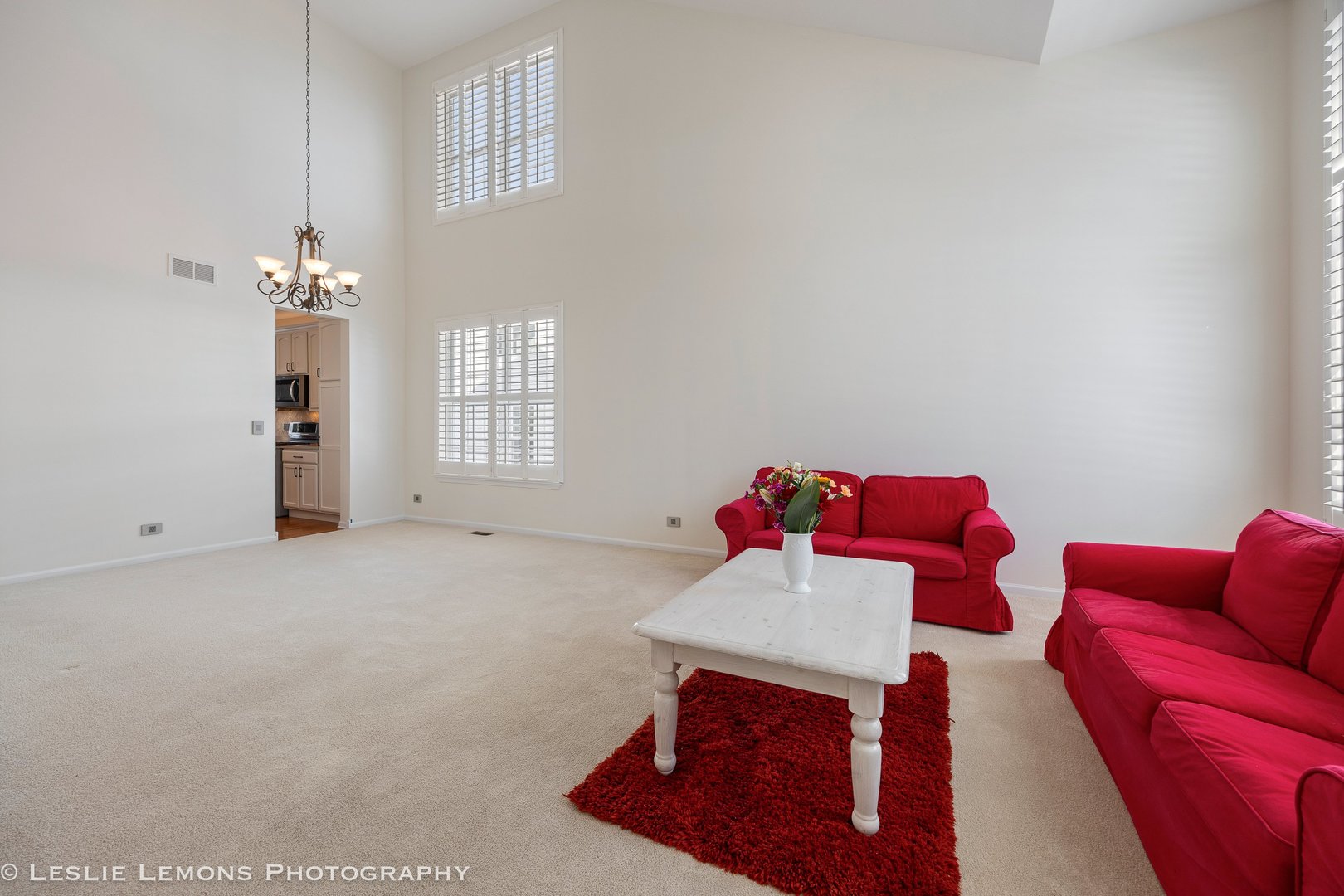526 Windett Lane Geneva, IL 60134 - Photo 2 of 38 a living room with furniture and a chandelier
