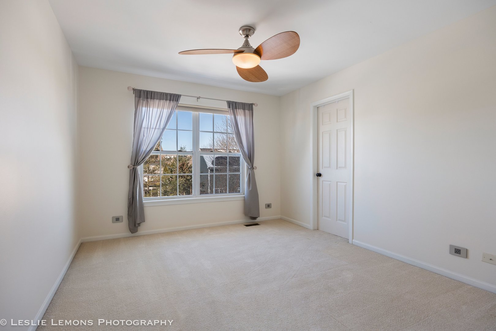 526 Windett Lane Geneva, IL 60134 - Photo 21 of 38 an empty room with windows and chandelier fan