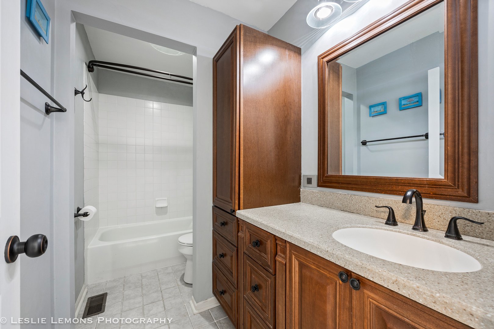 526 Windett Lane Geneva, IL 60134 - Photo 23 of 38 a bathroom with a granite countertop sink mirror and a bathtub