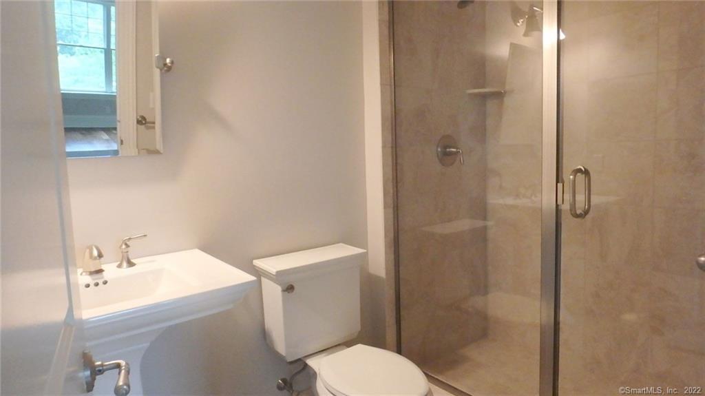 75 Stone Ridge Way, Unit 3E Fairfield, CT 06824 - Photo 12 of 23 Second bathroom with large standing shower stall