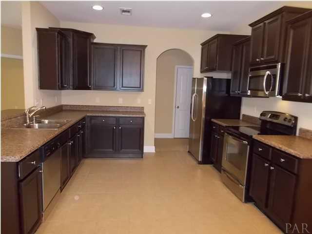 5512 Heatherton Road Milton, FL 32570 - Photo 2 of 25 Abundant dark Maple wood cabinets.