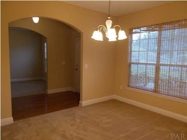 5512 Heatherton Road Milton, FL 32570 - Photo 8 of 25 Formal Dining view into Study through arched entryways.