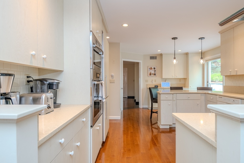 25 Ellen Road Stoneham, MA 02180 - Photo 16 of 41 a kitchen with a sink appliances and cabinets