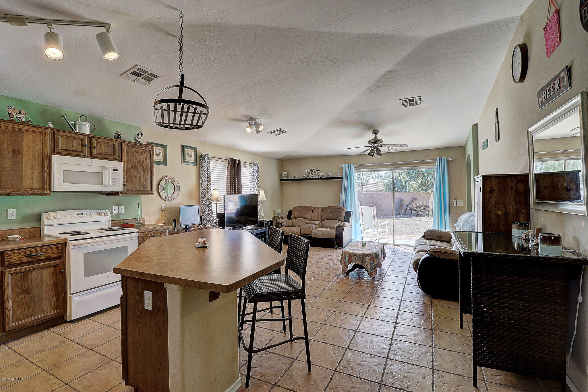14825 West Wethersfield Road Surprise, AZ 85379 - Photo 9 of 24 Kitchen to open living area