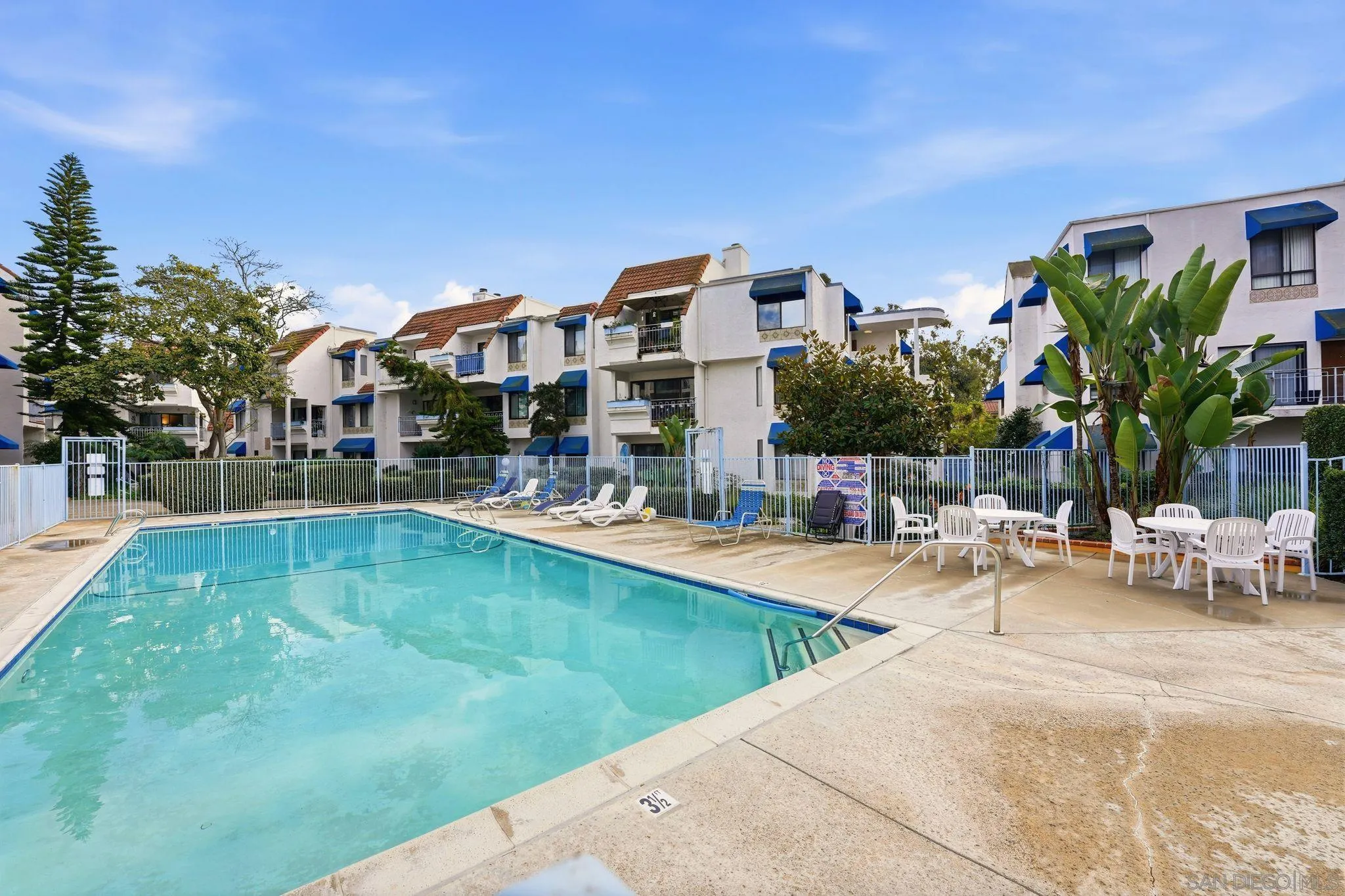 8310 Regents Road, Unit 1E San Diego, CA 92122 - Photo 18 of 28 a swimming pool with outdoor seating and yard