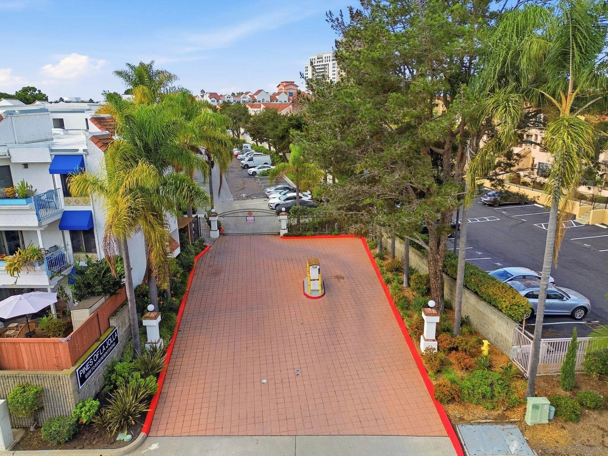 8310 Regents Road, Unit 1E San Diego, CA 92122 - Photo 21 of 28 a view of a backyard with plants and a patio